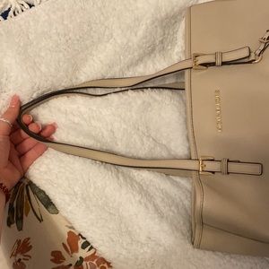 Medium sized Michael Kors bag.